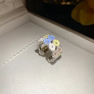 Close-up of elegant resin flower ring with sparkly cubic zirconia centers