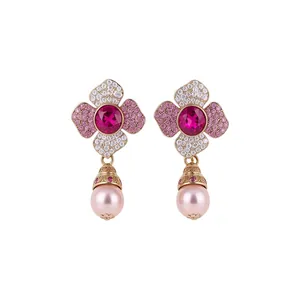 Exquisite floral pearl drop earrings with sparkling pink crystals and ornate gold finish detail