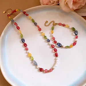 Close-up detail of colorful stone and pearl beaded dopamine style necklace and bracelet set