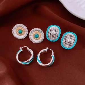 Vintage turquoise and silver-tone earring set featuring floral, mesh, and hoop designs.