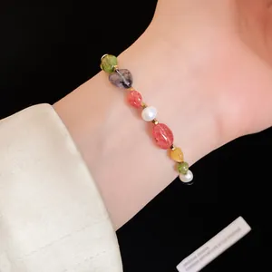 Detailed view of dopamine-style beaded bracelet with natural stones and pearls on wrist