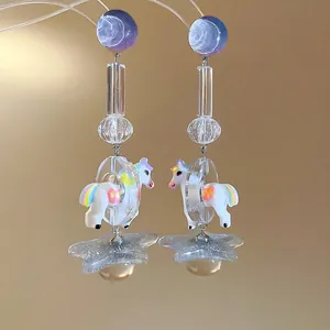 Whimsical resin carousel horse drop earrings featuring stars and clear beads for women