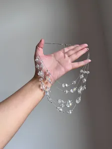 Detailed view of fashion multilayer necklace featuring clear crystal beads and silver balls