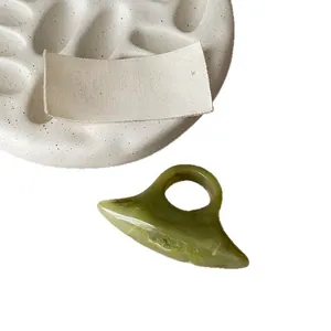 Minimalist olive green resin oval ring featuring an elegant marbled texture and artistic style
