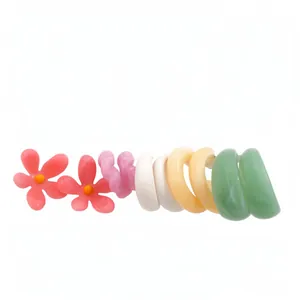 10-piece colorful dopamine resin earring set featuring floral and twisted hoop designs