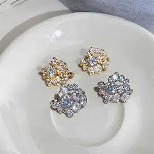 Elegant round zircon ear clips in gold and silver finish, perfect for non-pierced ears.