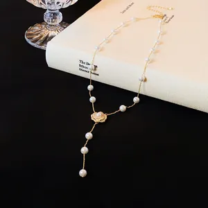 Elegant camellia pendant pearl necklace with zircon details in a minimalist setting