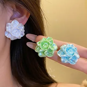 Elegant iridescent resin flower stud earrings set with pearl finish for summer vacations