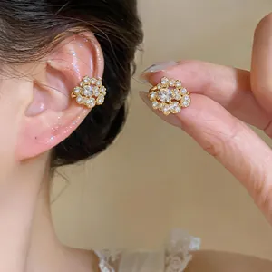 French luxury gold-tone ear cuffs with cluster of round zircons for non-pierced ears