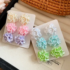 Detailed view of a six-pair colorful resin rose stud earring set with pearl luster