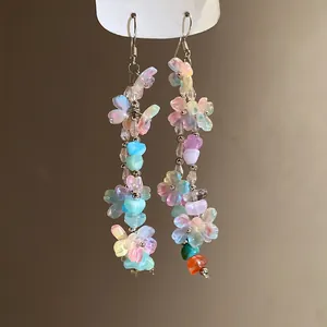 Macro view of colorful dopamine style resin flower tassel drop earrings for women