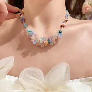 Detailed close-up view of a colorful resin flower choker necklace worn on a model's neck