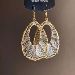 Elegant gold oversized water-drop earrings with woven thread and sparkling rhinestones