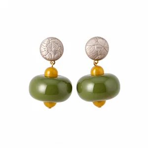 Minimalist olive green resin drop earrings with textured metallic studs.