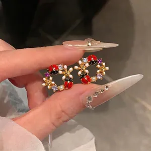 Orecchini in zircone placcato oro 18k con design a coccinella e fiori in smalto dolce