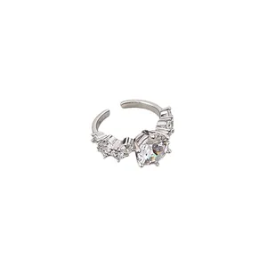 Elegant silver open ring featuring geometric zircon inlays on a clean white background.