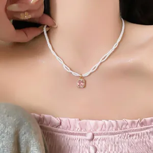 Elegant French pearl strand necklace with a sparkling pink rectangular zircon pendant