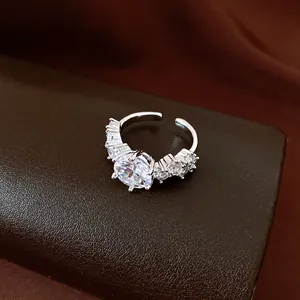 Detailed macro shot of a vintage silver open ring with sparkling round zircon stones