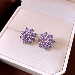 Elegant purple zircon flower stud earrings for women presented in a premium white jewelry box
