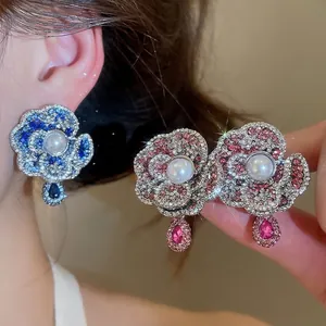 Vintage pearl flower stud earrings with colorful crystals and hanging drop accents