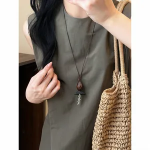 Bohemian vintage ethnic necklace with wood resin pendant on leather cord for women