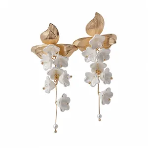 Vintage pearl flower tassel dangle earrings in an elegant gold and white design