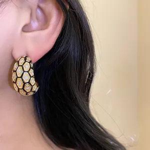 Close-up view of luxury vintage 18k gold plated hoop earrings with honeycomb zircon pattern