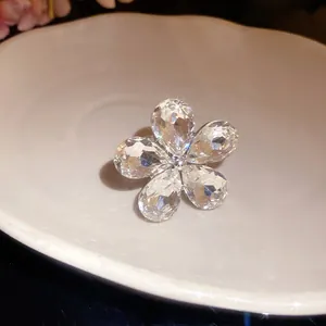 Exquisite detail view of a clear sparkling crystal flower open ring with teardrop petals