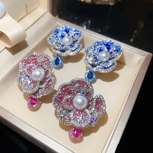 Elegant retro flower-shaped earrings with faux pearls and sparkling crystals in gift box