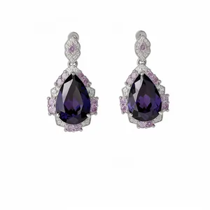 Elegant pear-shaped drop earrings with deep purple and pink stones in silver finish.