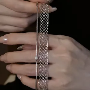 Close-up detail showing the intricate weave of a minimalist silver metal mesh bracelet