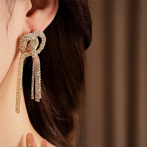 Elegant silver needle knot tassel earrings with sparkling rhinestones for women