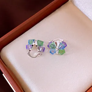 Close-up detail of vintage colorful square crystal ear buckle earrings in a gift box
