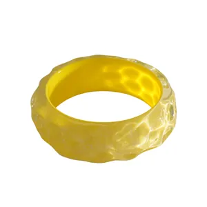Vibrant yellow dopamine style resin bangle bracelet with iridescent crinkle texture detail
