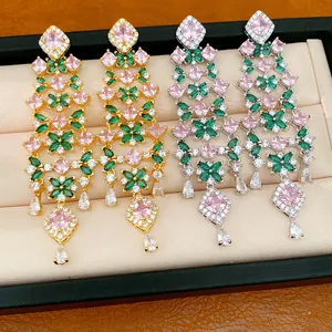 Detailed view of vintage zircon floral tassel earrings in gold and silver plating