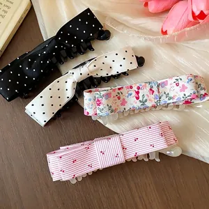 Assorted Korean style fabric bow banana clips with polka dots and sweet floral patterns