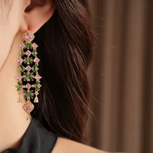 Close-up of elegant court-style tassel earrings with pink and green floral cubic zirconia