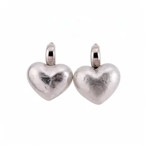 Vintage style silver heart-shaped drop earrings with a textured hammered metal finish
