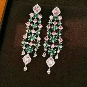 Detailed macro view of 18k gold plated pink and green flower zircon drop earrings