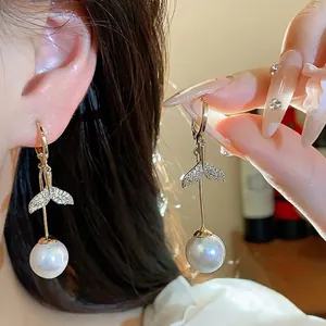 Elegant 18K gold plated fishtail earrings featuring sparkling zircon and an iridescent pearl