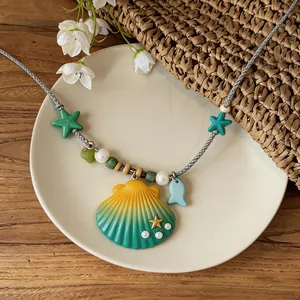 Detailed close-up of a summer beach shell necklace with starfish charms on a ceramic plate