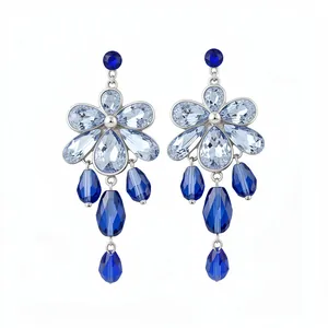 Elegant silver drop earrings featuring blue floral crystals and multifaceted teardrop pendants