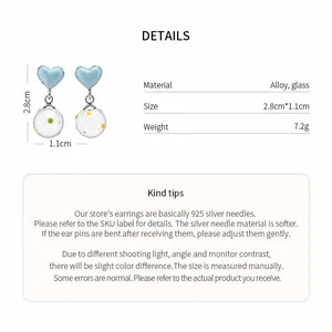 Detail view showing heart-shaped earrings with glass drop specifications and size measurements.