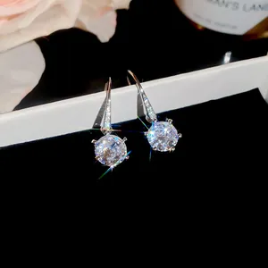 Close-up of elegant micro-paved cubic zirconia round drop earrings with brilliant sparkle