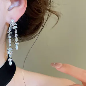 Close-up of double-row cubic zirconia fringe earrings with brilliant marquise cut details