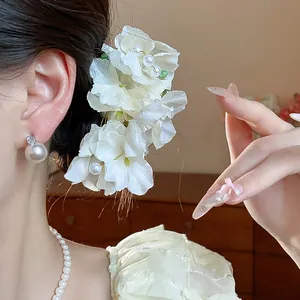 Elegant white fabric flower hair clip with pearls for a sweet and sophisticated look