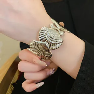 Macro view of a silver hollow starfish cuff bracelet with elegant shell texture on a wrist