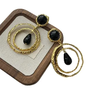 Vintage oversized ethnic gold hoop earrings with black cabochon and teardrop pendants
