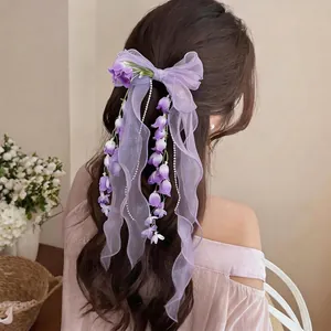 Elegante fermaglio per capelli con fiocco in chiffon viola e nappe di perle