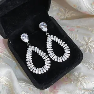 Close-up of elegant silver teardrop earrings with sparkling cubic zirconia stones